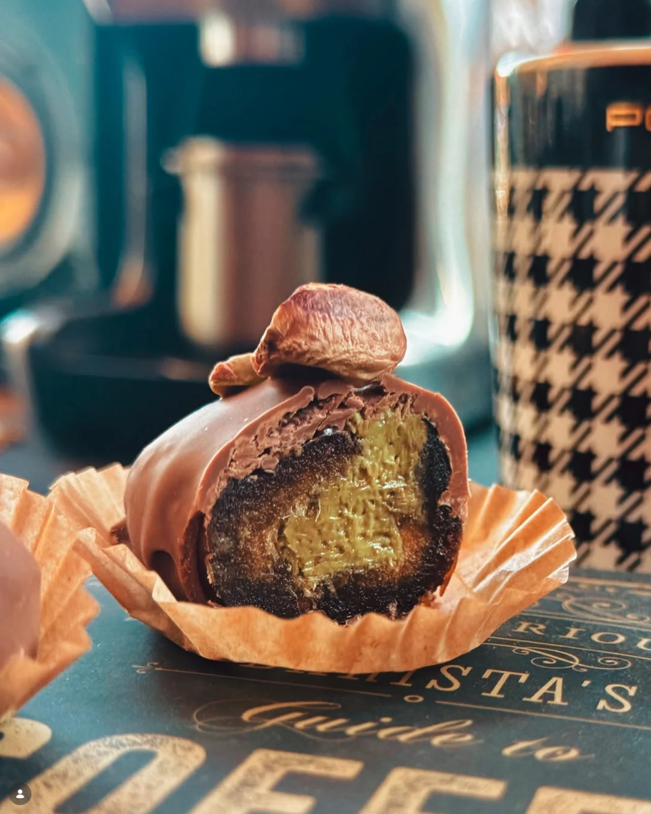 A pistachio-filled chocolate close-up at Bonibon